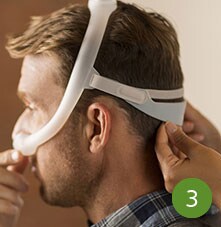 man wearing sleep apnea mask